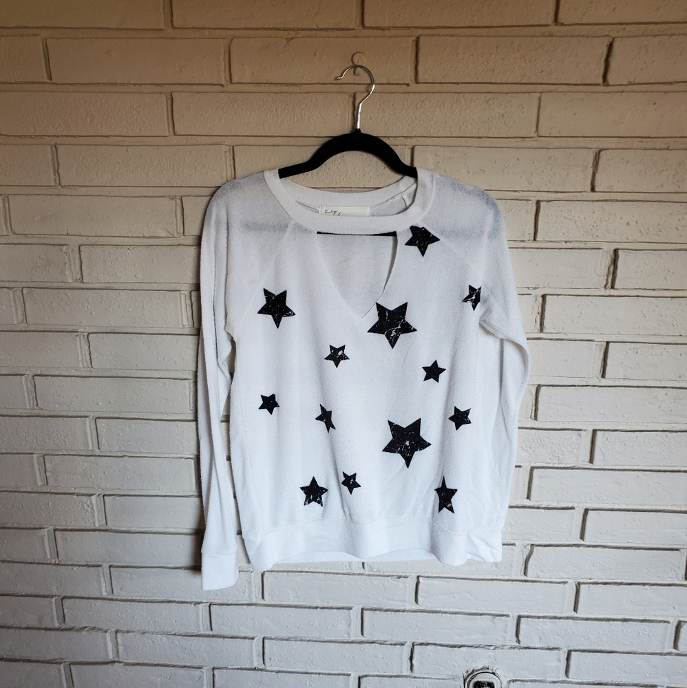 White sweater with black stars